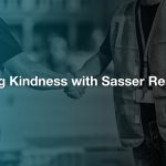 Two people wearing construction vests shaking hands with the text "Restoring Kindness with Sasser Restoration" over the top of the photo.